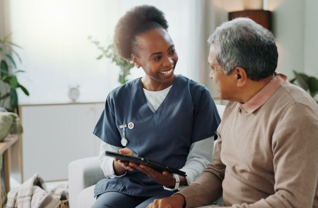 A senior in a memory care community getting help with healthcare and medication from a nurse