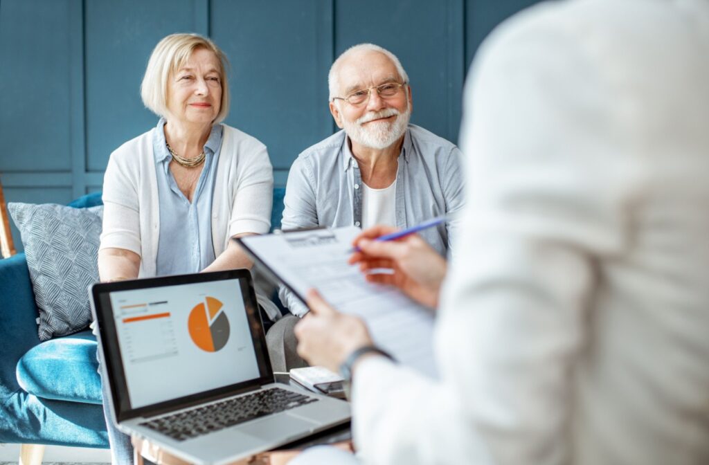 A senior couple consults with a financial advisor.